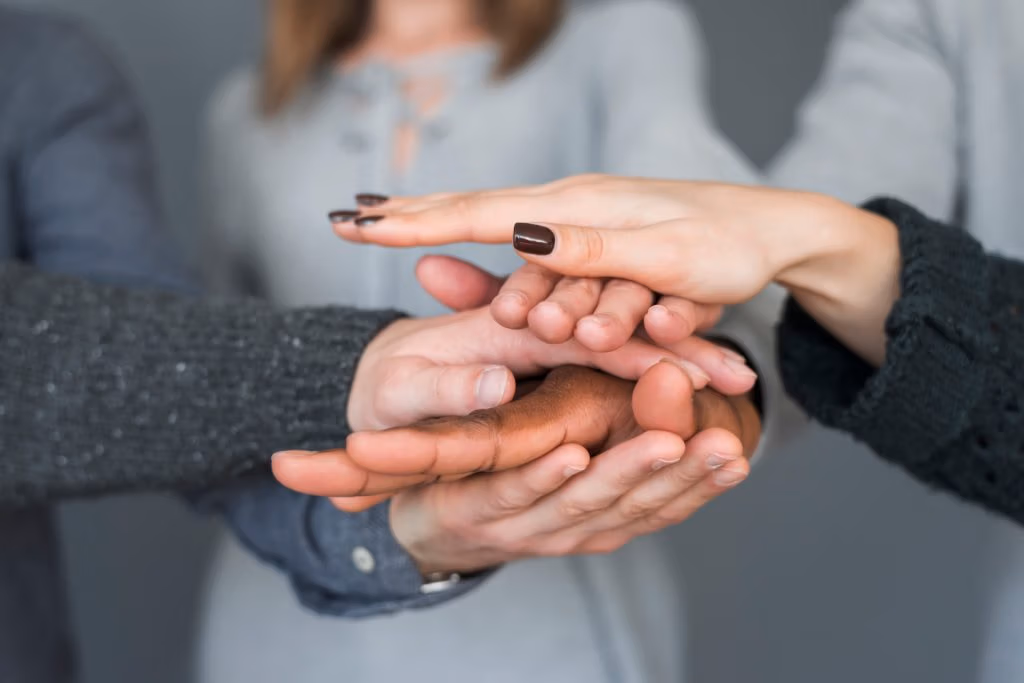 Teamwork concept with hands of group of people